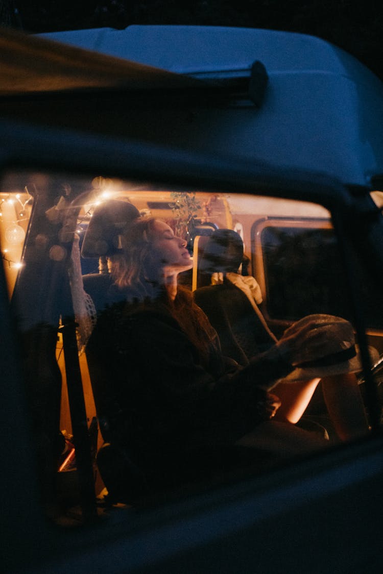 Woman Sleeping In The Front Seat Of A Car