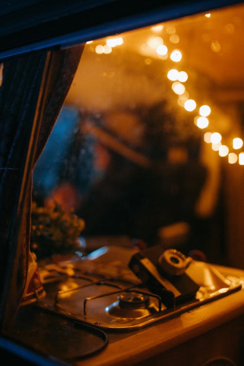 A Camera on the Stove inside a Camper Van