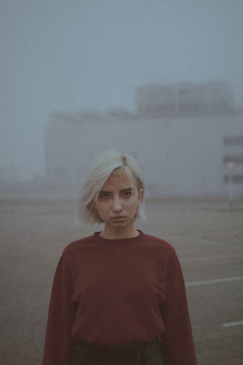 A Staring Woman Wearing a Red Sweater