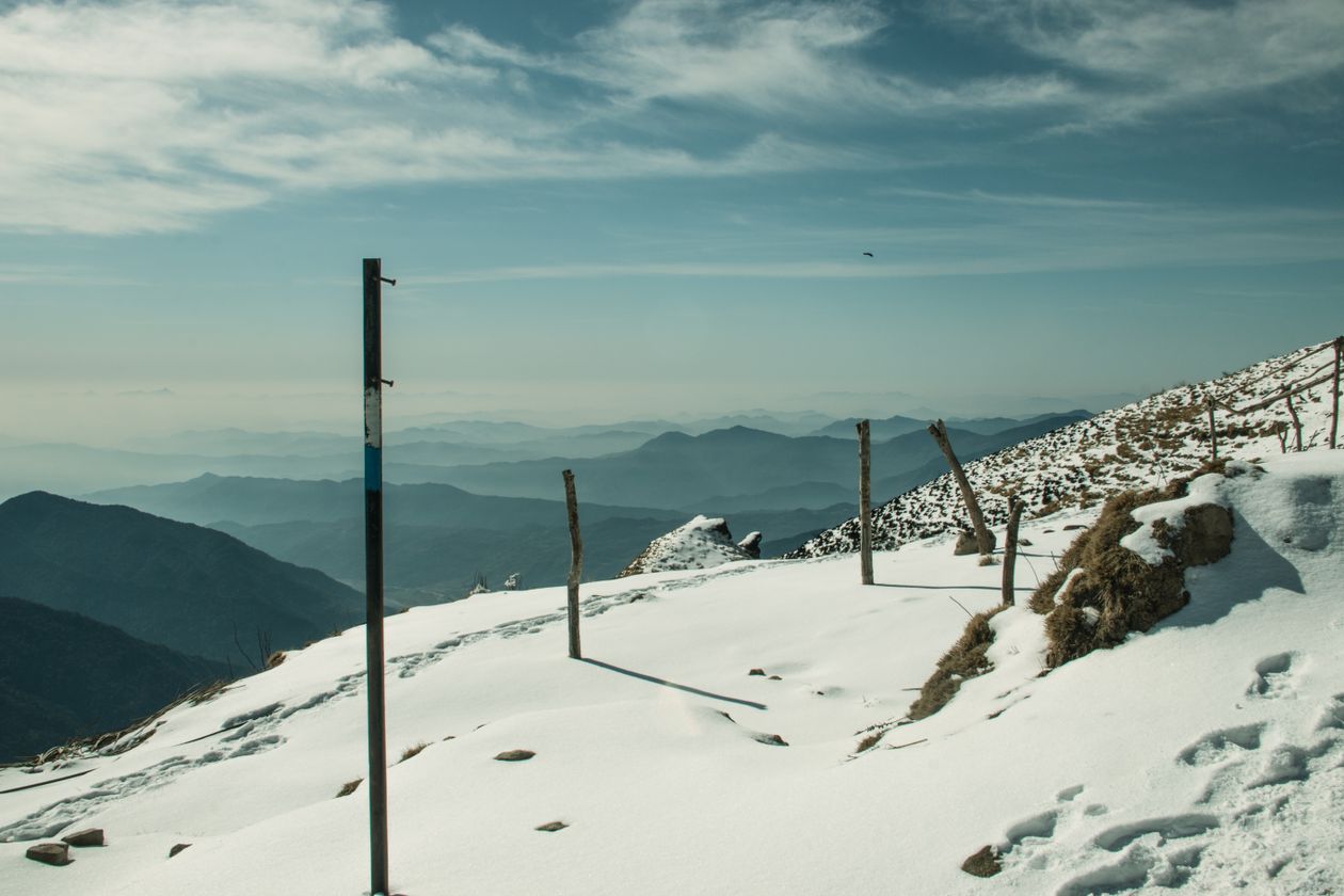 Snow-covered mountain trail in winter hiking conditions