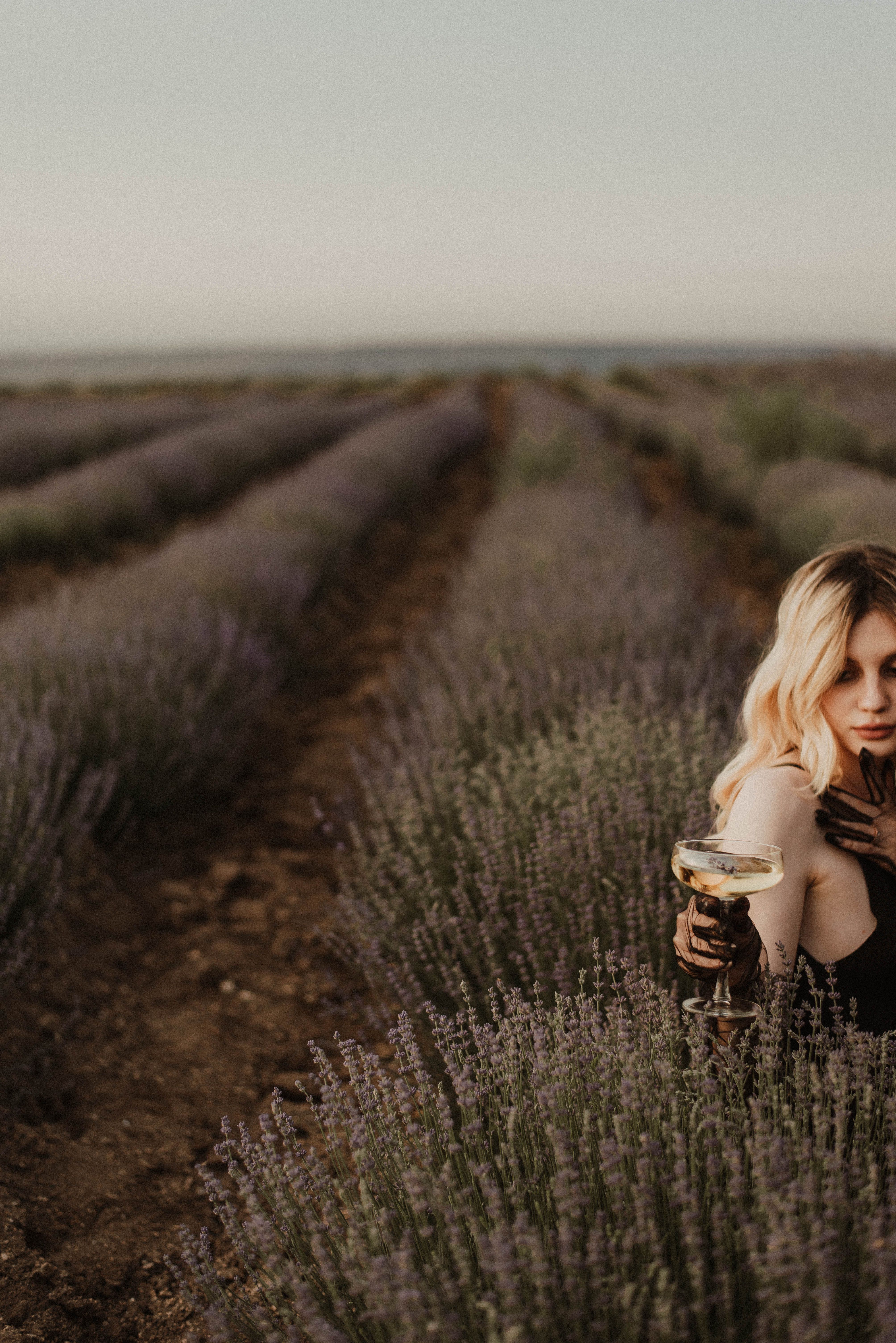 Woman Sitting in Grass Field · Free Stock Photo