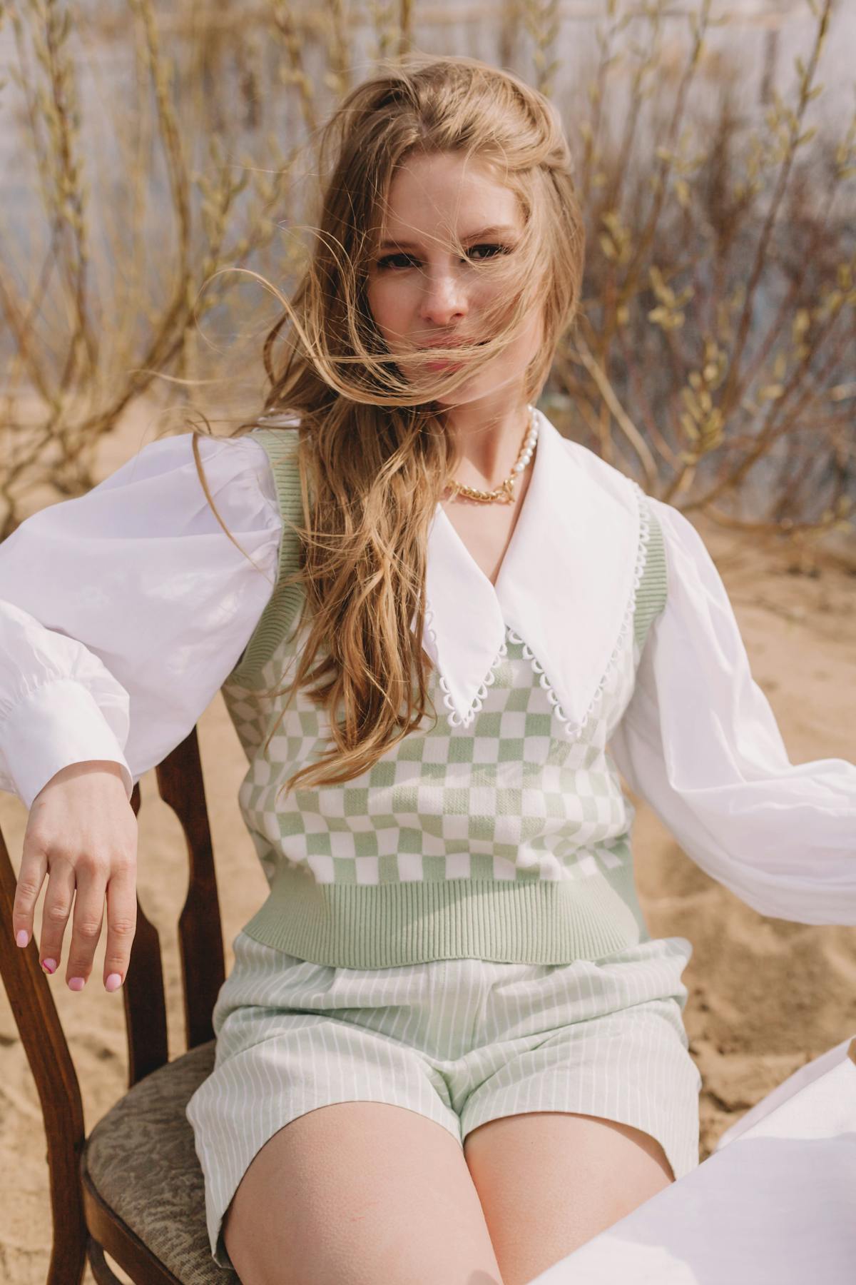 Person preparing a colorful, balanced meal with vegetables, grains, and protein