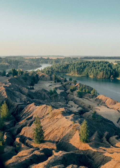 Free A breathtaking aerial view of Kondyukki's unique sand dunes and lush surrounding forest. Stock Photo