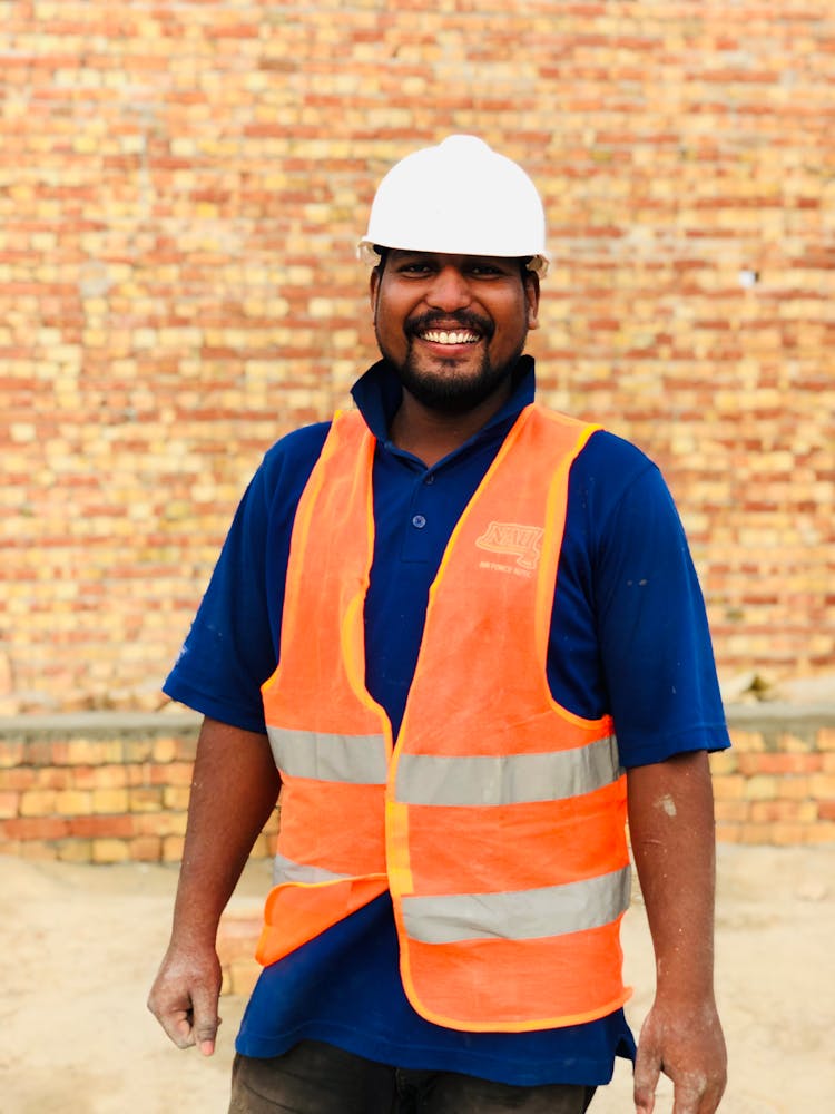 A Portrait Of A Smiling Worker