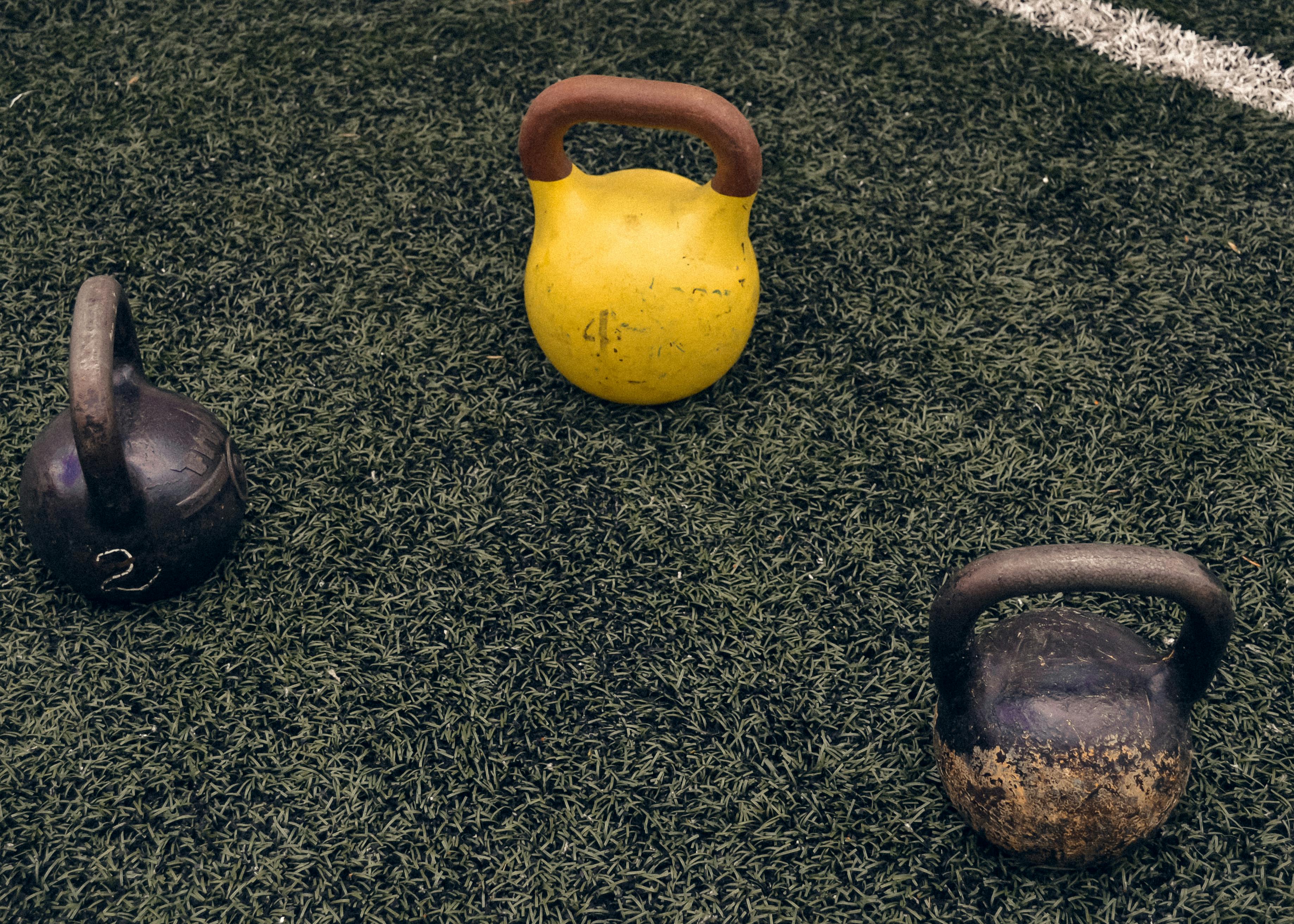 A Person Lifting a Kettlebell · Free Stock Photo