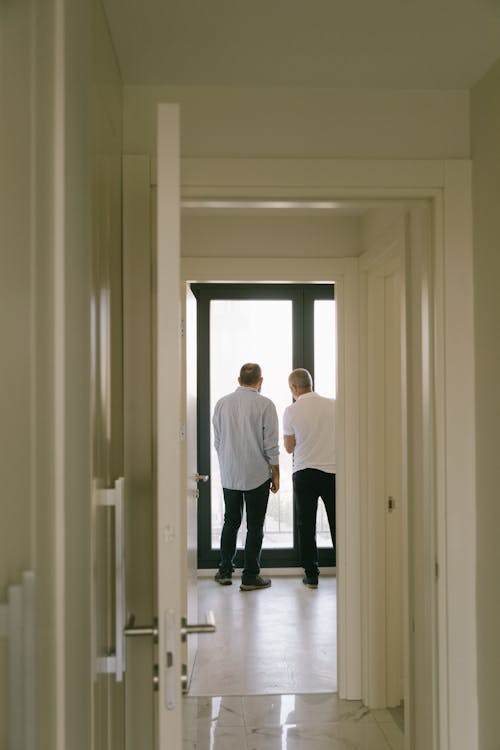 Free Men Standing Inside a Room Stock Photo