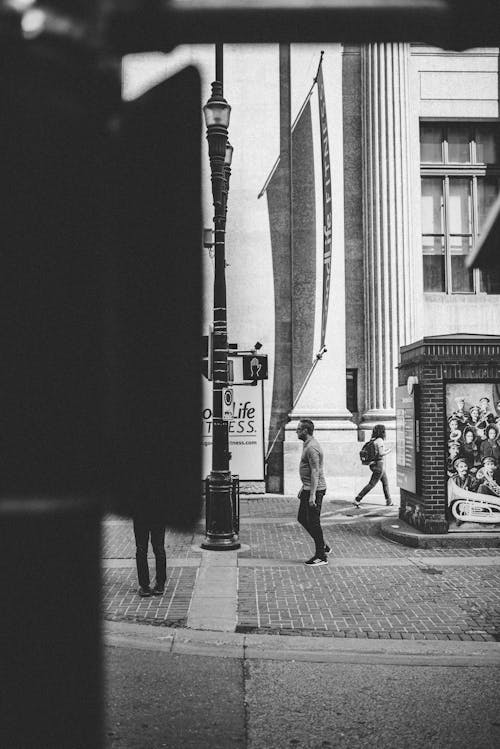 Grayscale Photo People Walking on Sidewalk