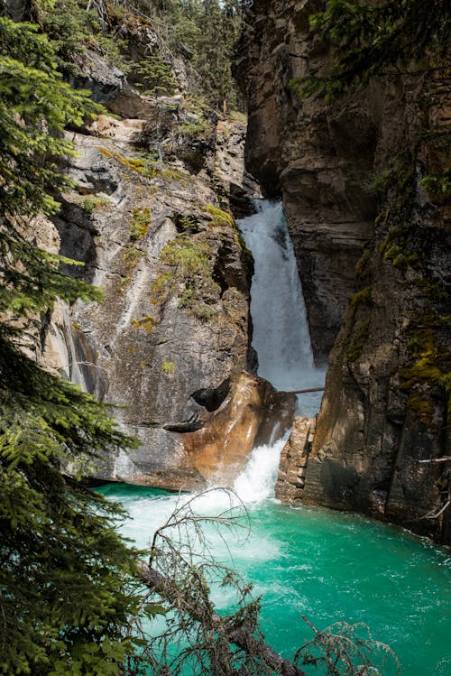 A Waterfall Between Rock Formations