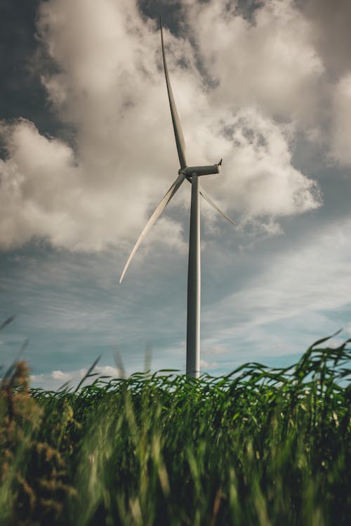 White Wind Turbine Under the Cloudy Sky