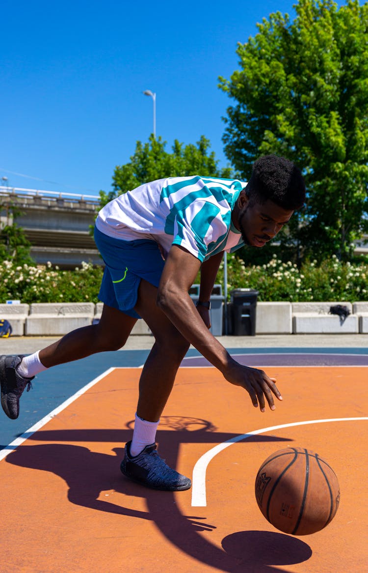 Man Dribbling The Ball