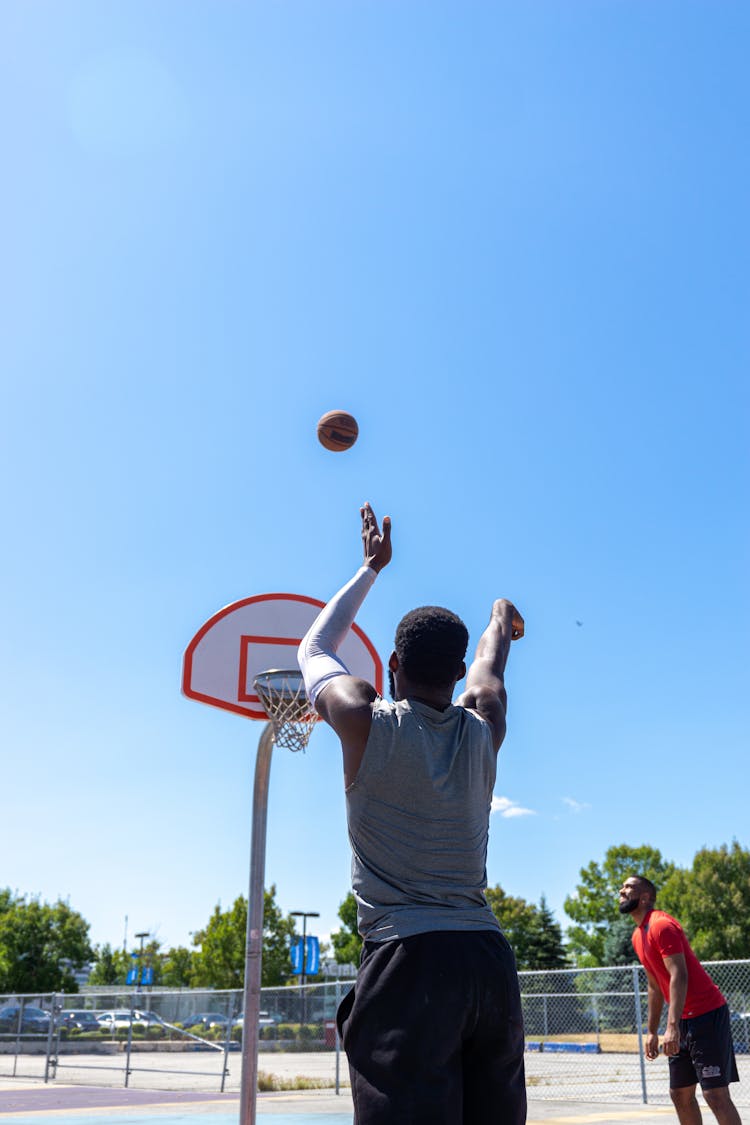 Back View Of A Man Playing Basketball