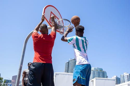 Two Men Playing Basketball