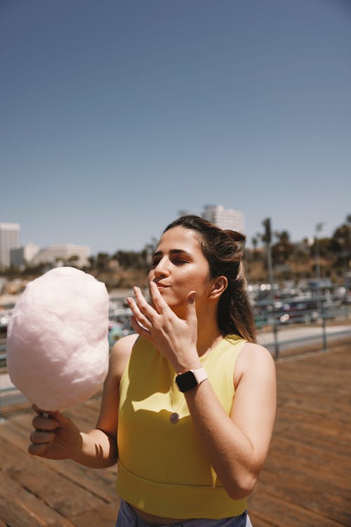 Free Woman Holding a Cotton Candy Stock Photo
