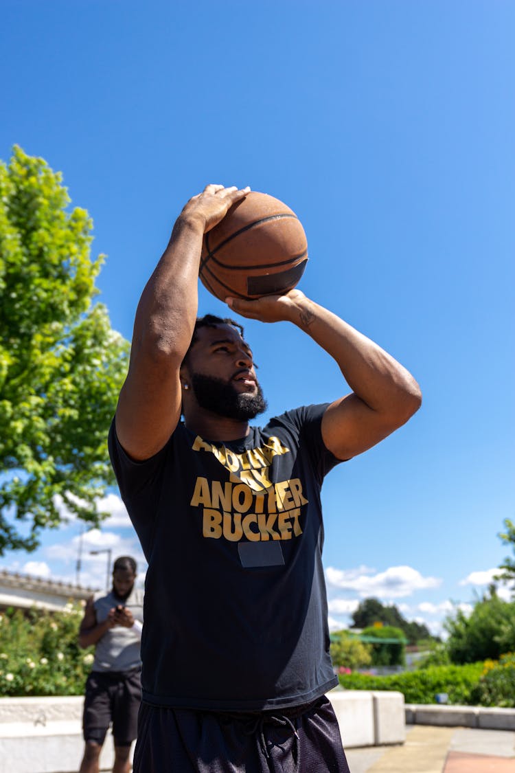 Man Shooting A Basketball