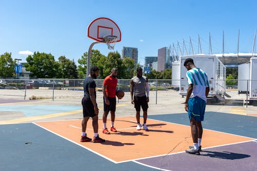 People Practicing Basketball