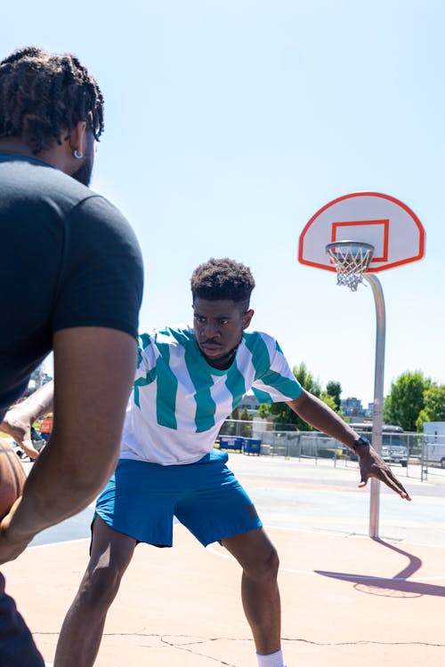 Two Men Playing Basketball