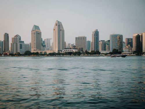 Free View of San Diego skyline with iconic buildings across the bay at daytime. Stock Photo