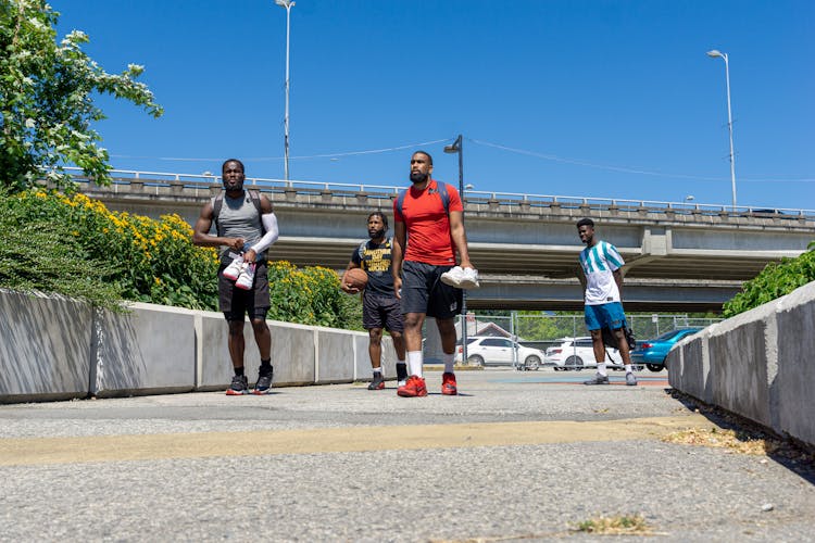 Group Of Friends In Activewear Walking Outdoors