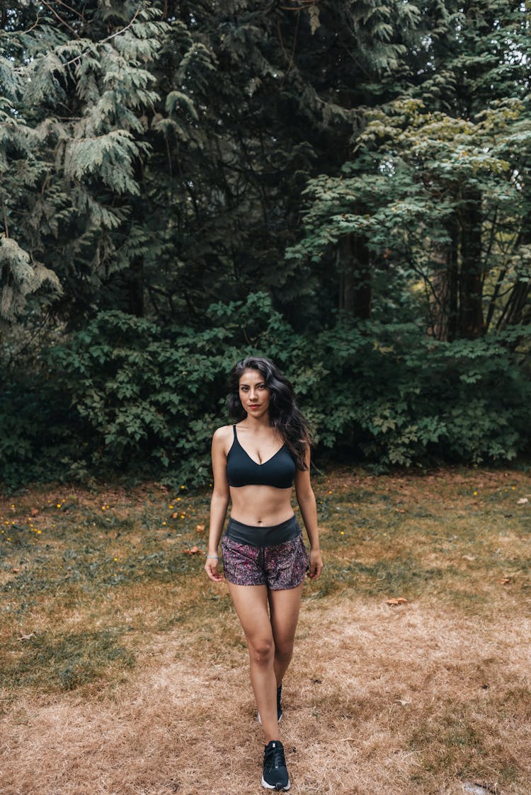 Woman In Black Sports Bra And Shorts Wearing Black Rubber Shoes