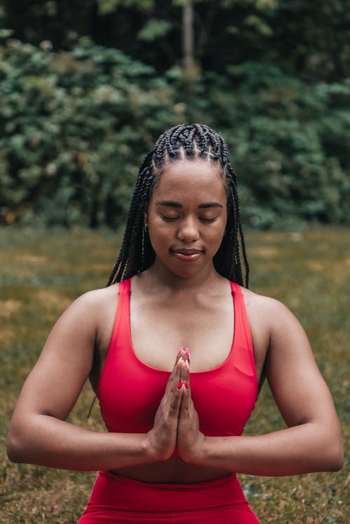 Woman in Red Activewear Meditating