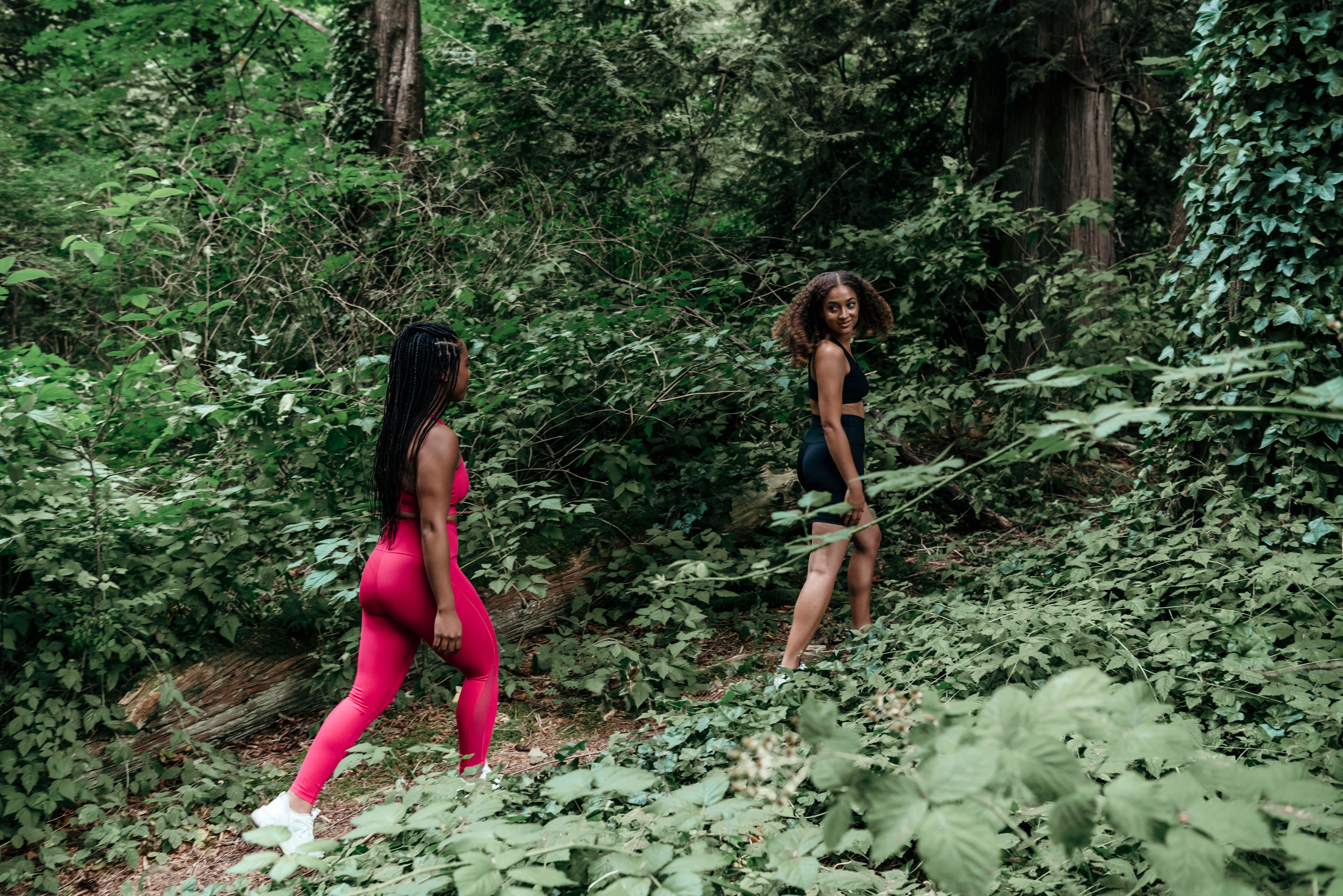 Two Friends Walking in a Forest · Free Stock Photo