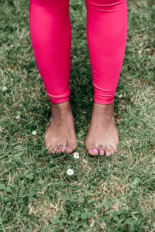 Free Close-Up Shot of a Person Standing on the Grass Stock Photo