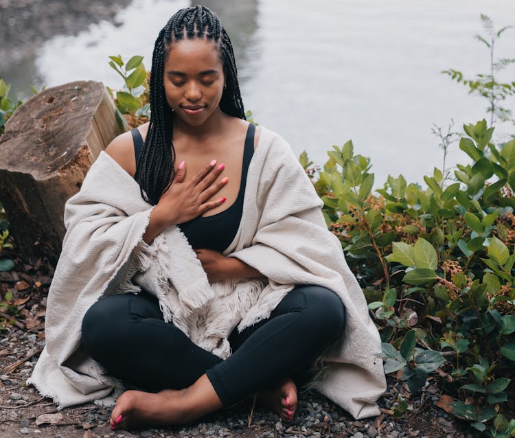 Close-Up Shot Of A Woman Meditating