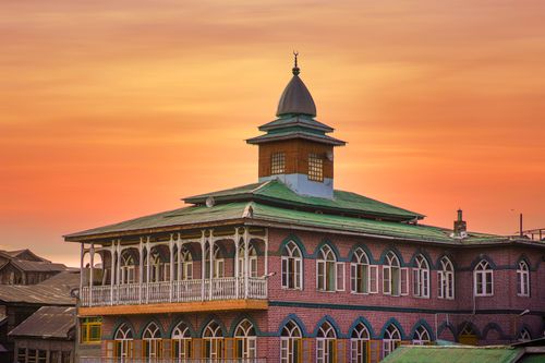 Free Beautiful sunset over a traditional mosque in Srinagar, showcasing unique architectural design. Stock Photo