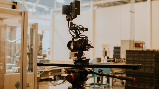 Detailed view of a camera rig set up for professional filming inside a studio setting.