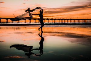 Sunset over the sea from a pier — photo by Saeid Anvar on Pexels