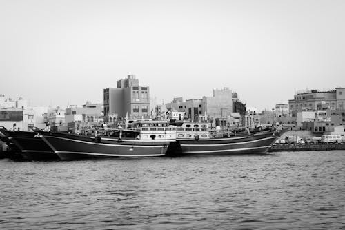 Monochrome Photo of Ships on the Dock