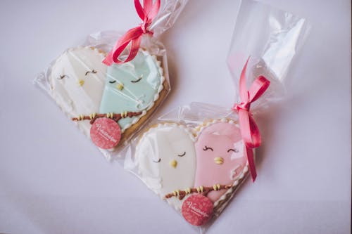 Two White-and-pink Heart Shaped Wrap in Clear Plastic Decors