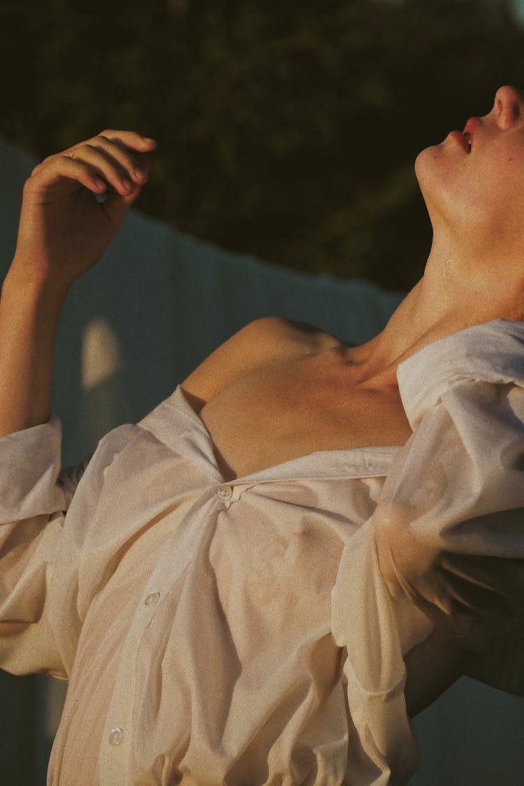 Close-Up Shot Of A Woman Wearing White Long Sleeves