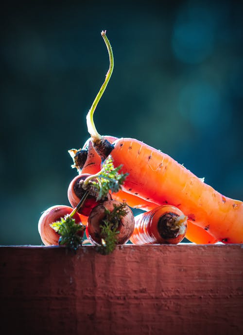 Orange Carrots on Brown Wooden Table