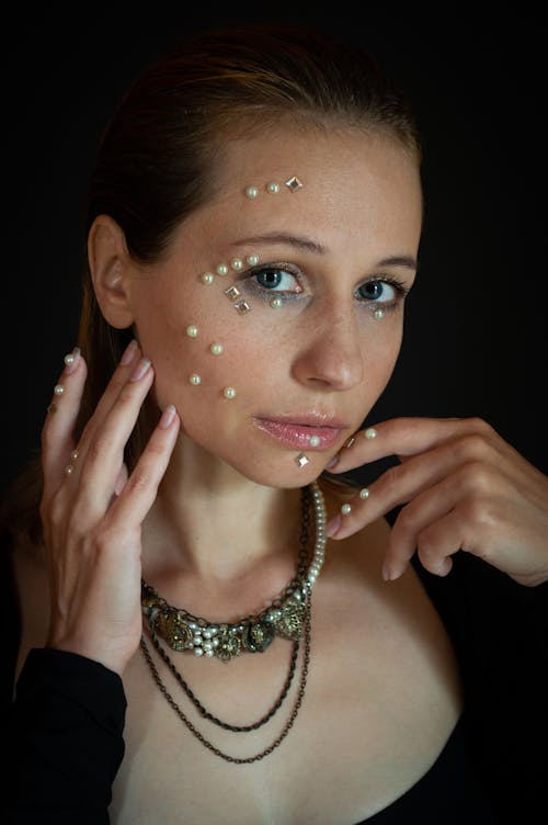 A Beautiful Woman with Pearls on Face