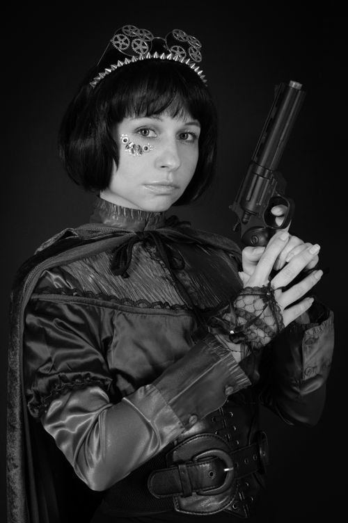 Free Steampunk-themed portrait of a woman in costume with mechanical gear details. Stock Photo