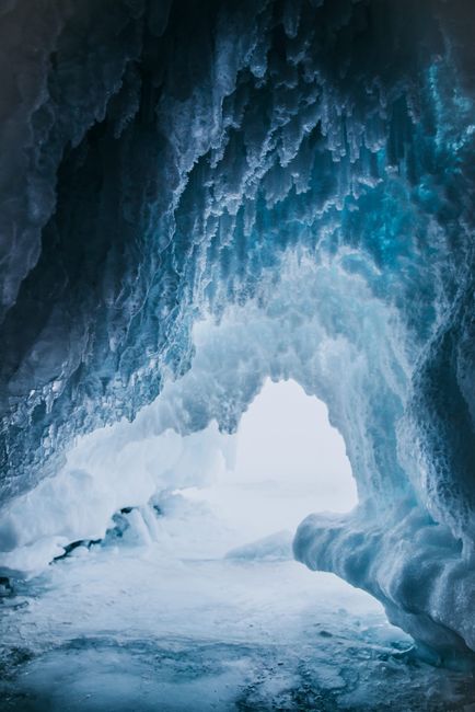 Explore the stunning ice formations within a glacier in Irkutsk, Russia's winter landscape.
