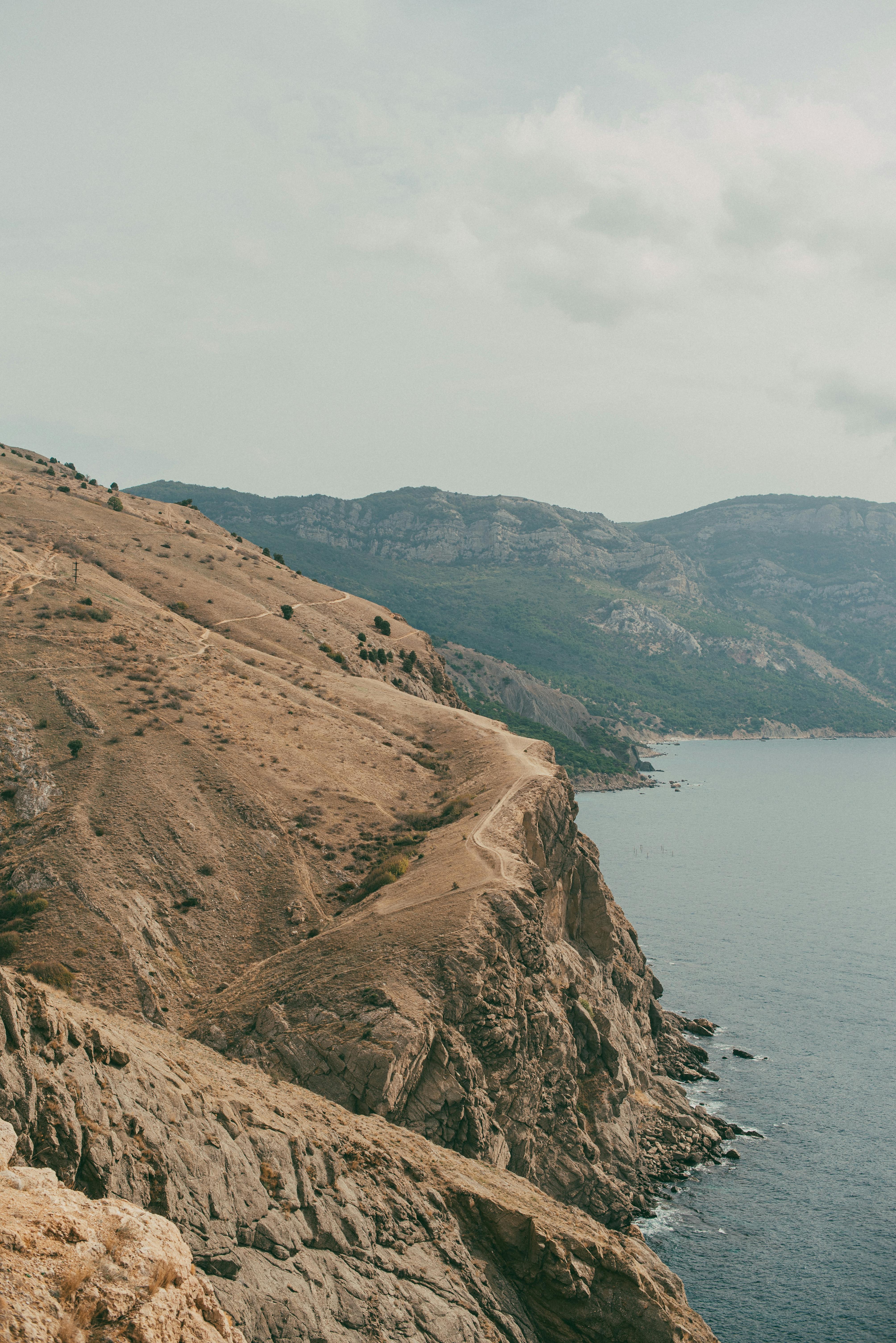 Scenic view of rugged coastal cliffs meeting the sea in Sevastopol.