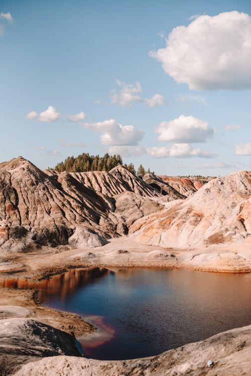 Free Scenic view of rock formations and tranquil lake in the Ural Mountains, Russia. Stock Photo