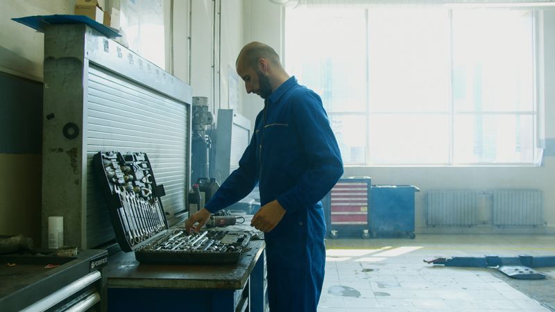 Technician inspecting mechanical equipment