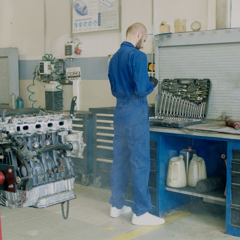Professional automotive technician inspecting vehicle systems