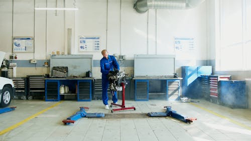 Free A Mechanic Fixing A Car Engine  Stock Photo