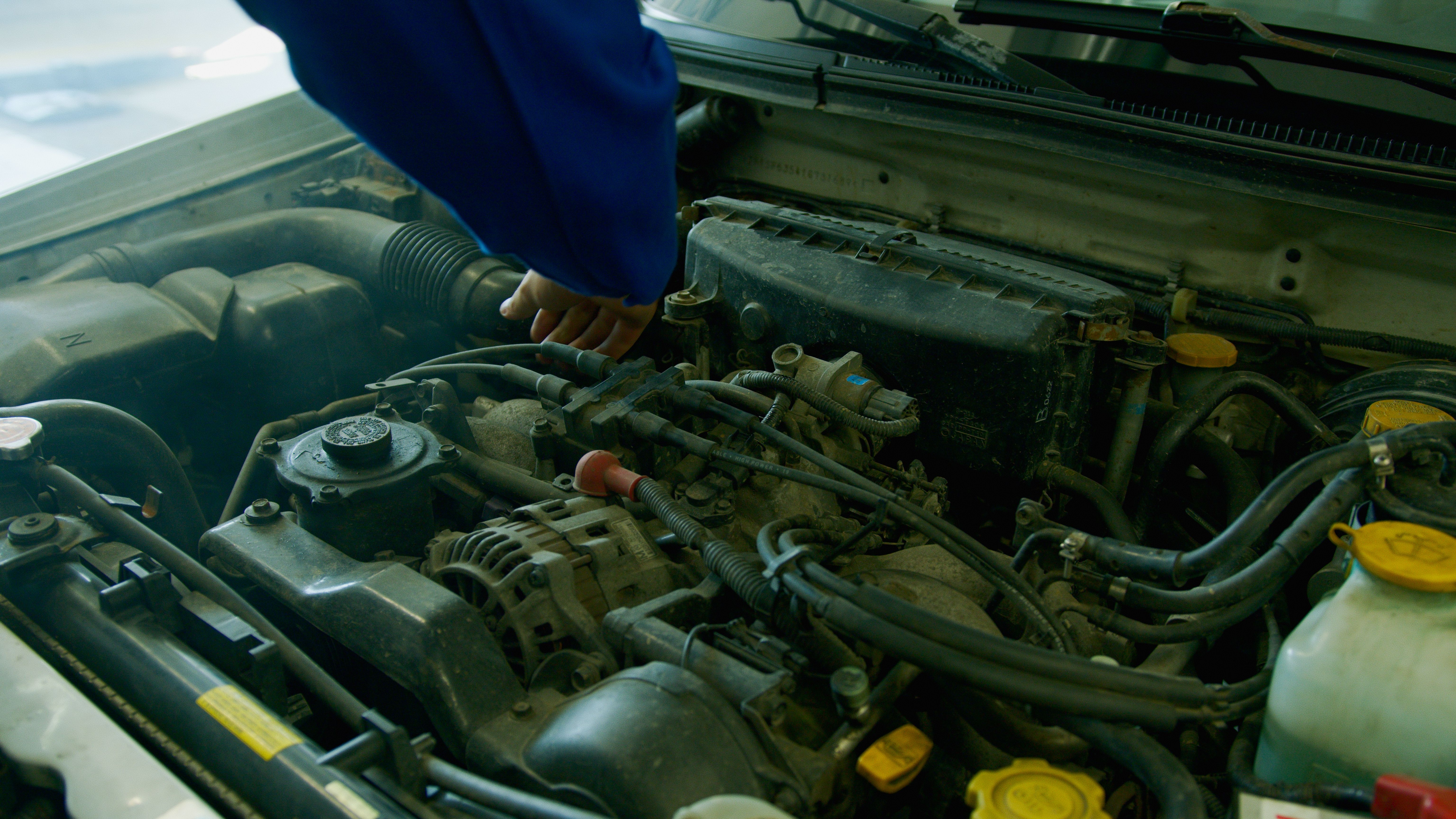 Mechanic Repairing Engine Free Stock Photo