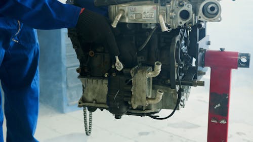Close-up of a Mechanic Fixing an Engine
