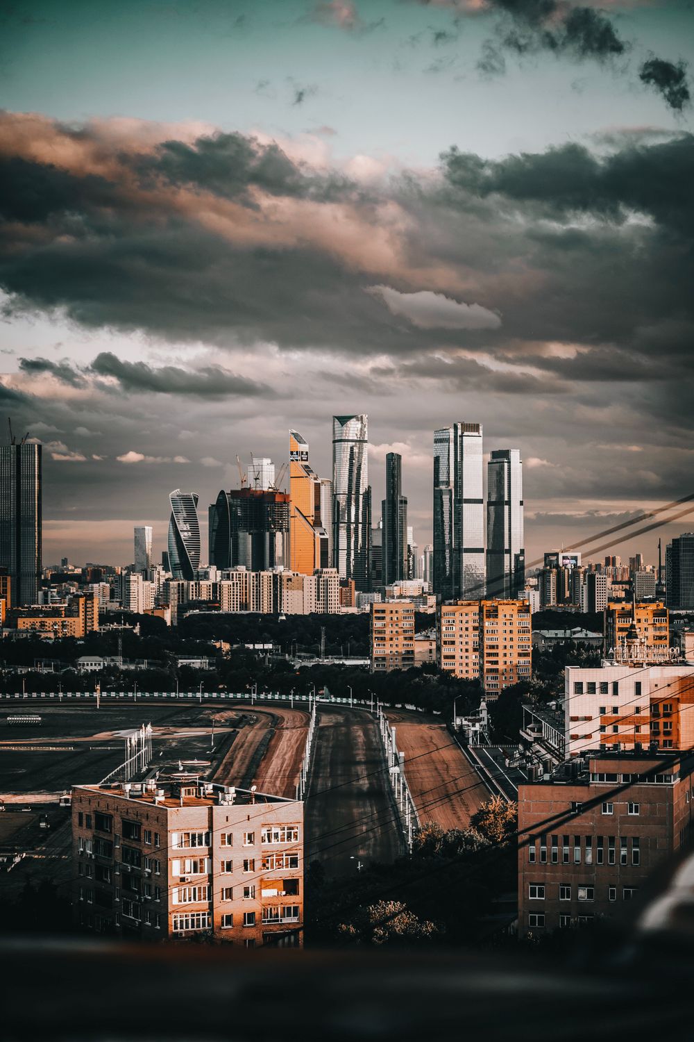 A Cityscape under a Cloudy Sky · Free Stock Photo