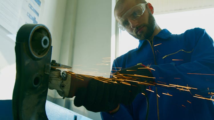 Man Using A Grinding Machine