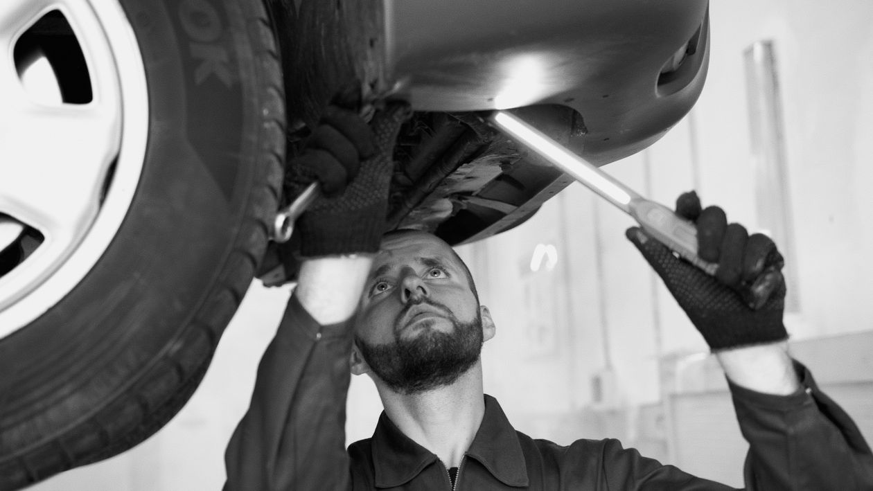 auto repair shop mechanic working on vehicle professional