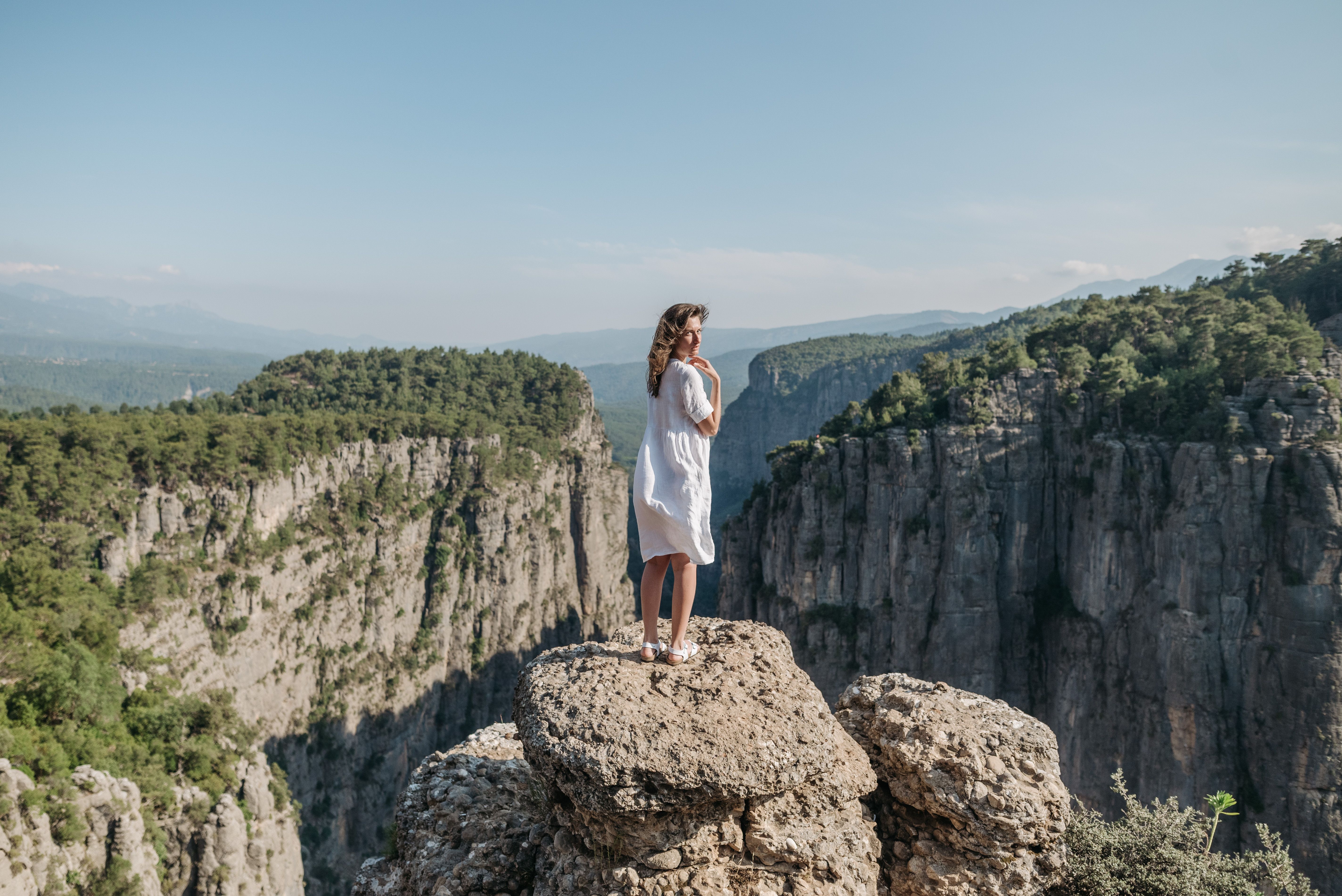 Woman in White Dress Standing on Rock · Free Stock Photo