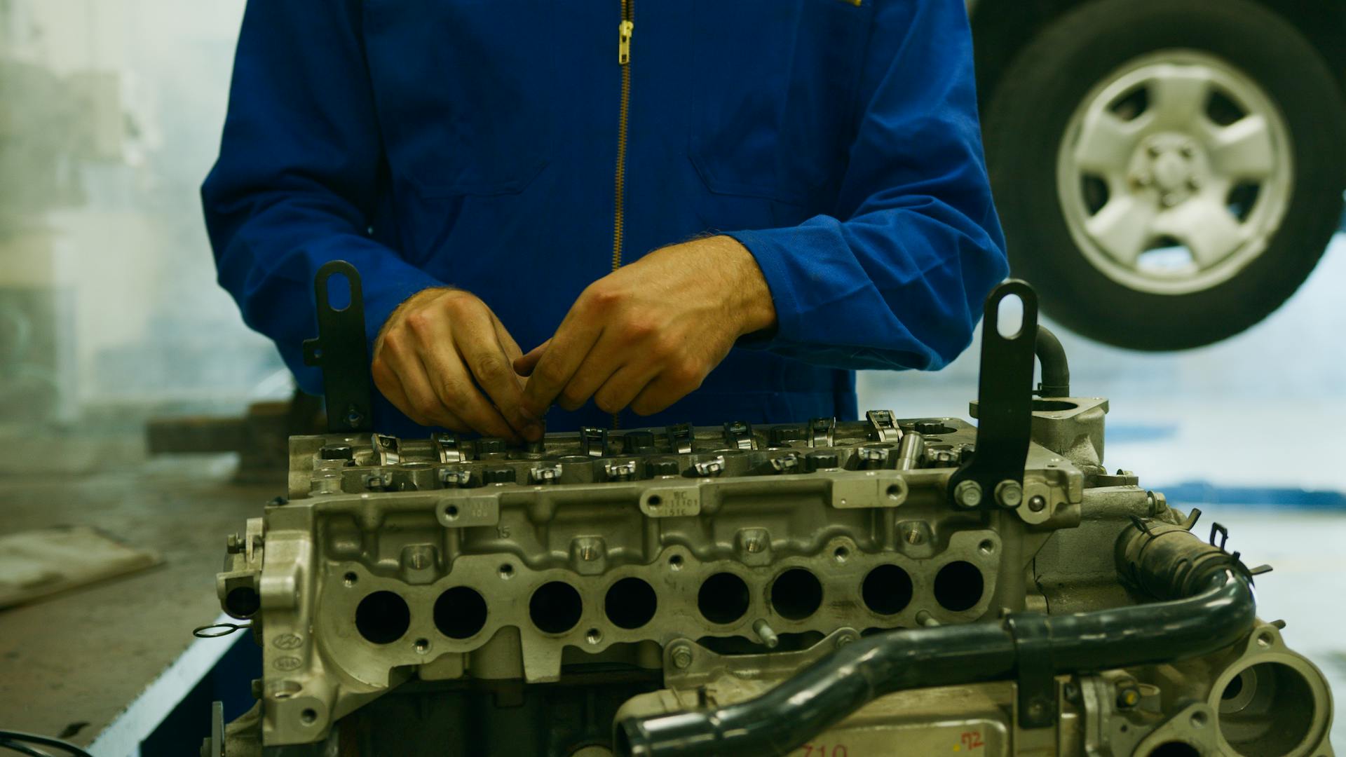 A Technician Repairing a Motor Part