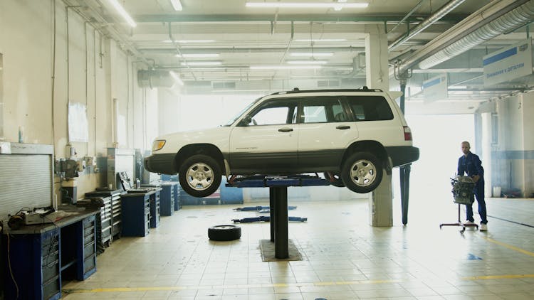 Car On Lift At  Auto The Repair Shop